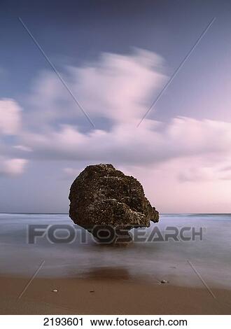 Stock Image - Barbados, Strange shaped rock in shallow waters; Bathsheba. Fotosearch