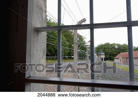 Stock Photo - Barbed Wire And Watchtower, Buchenwald Concentration Camp, Germany. Fotosearch