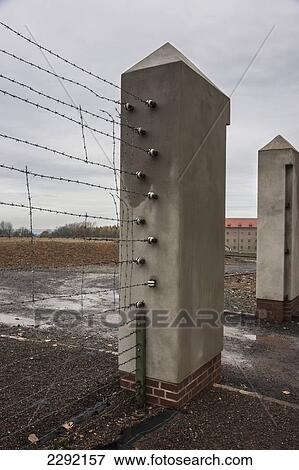 Stock Photo - Barbed wire fencing, Buchenwald Concentration Camp; Buchenwald, Germany. Fotosearch