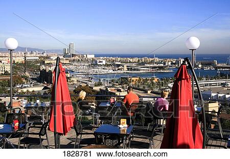 Stock Image - Barcelona, Catalonia, Spain; Harbour View From Outdoor Cafe. Fotosearch