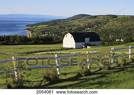 Stock Image - Barn And St. Lawrence River At Sunrise, Charlevoix Region, Saint-Irenee, Quebec. Fotosearch