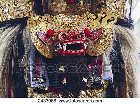 Stock Photograph - Barong, a mythical lion-like creature in a Barong dance performance in Batubulan, Bali, Indonesia. Fotosearch
