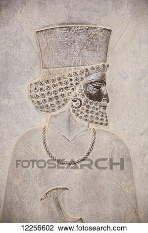 Stock Image - Bas relief carving on Eastern Apadana Staircase; Persepolis, Iran. Fotosearch