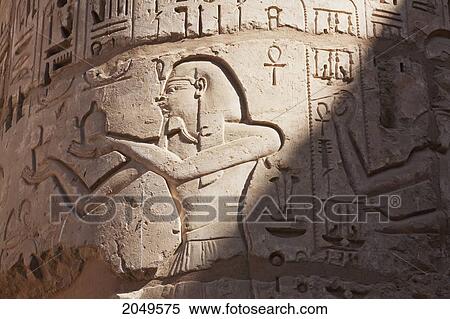 Bas-Relief On A Column In Papyrus Style In The Second Courtyard Of The Mortuary Temple Of Ramses Iii, Medinat Habu, Luxor, Qina, Egypt View Large Photo Image Stock Photography - Bas-Relief On A Column In Papyrus Style In The Second Courtyard Of The Mortuary Temple Of Ramses Iii, Medinat Habu, Luxor, Qina, Egypt. Fotosearch