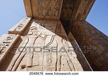 Stock Photograph - Bas-Reliefs On The Second Pylon Of The Mortuary Temple Of Ramses Iii, Medinat Habu, Luxor, Qina, Egypt. Fotosearch