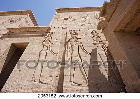Bas-Reliefs On Western Tower, Ptolemy Xii Offers Incense And Dedicates Sacrificial Animals To Horus, Hathor And Other Gods. Second Pylon Of The Temple Of Isis, Philae, Aswan, Egypt View Large Photo Image Stock Image - Bas-Reliefs On Western Tower, Ptolemy Xii Offers Incense And Dedicates Sacrificial Animals To Horus, Hathor And Other Gods. Second Pylon Of The Temple Of Isis, Philae, Aswan, Egypt. Fotosearch