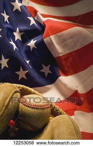 Baseball and glove on an American flag View Large Photo Image Stock Photo - Baseball and glove on an American flag. Fotosearch