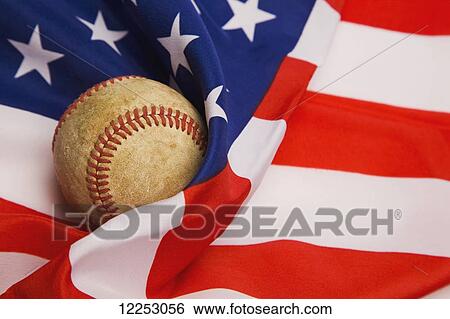 Stock Photograph - Baseball on an American flag. Fotosearch