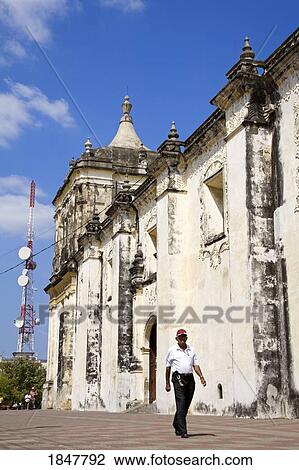 Stock Image - Basilica Cathedral De La Asuncion, Leon, Nicaragua, Central America; Person Walking By Historic Cathedral. Fotosearch