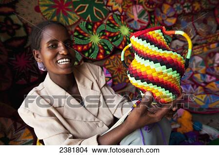 Picture - Basket maker with colourful basket ware; Axum, Tigray, Ethiopia. Fotosearch