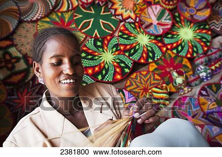 Basket maker with colourful basket ware; Axum, Tigray, Ethiopia View Large Photo Image Stock Image - Basket maker with colourful basket ware; Axum, Tigray, Ethiopia. Fotosearch