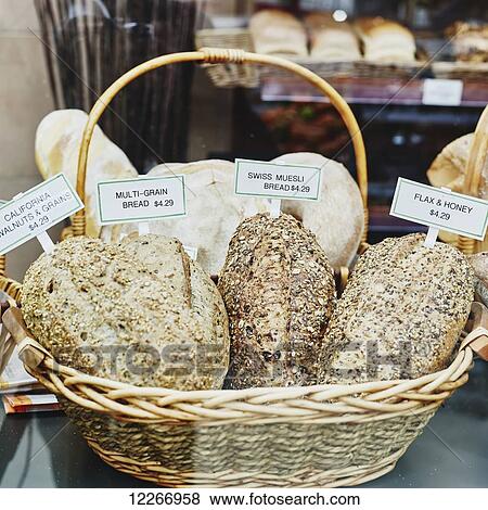 Basket of a variety of healthy breads for sale in bakery display case; Ontario, Canada View Large Photo Image Stock Photo - Basket of a variety of healthy breads for sale in bakery display case; Ontario, Canada. Fotosearch