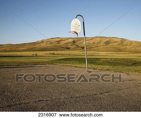 Stock Photo - Basketball Hoop In Rural Schoolyard; Alberta Canada. Fotosearch