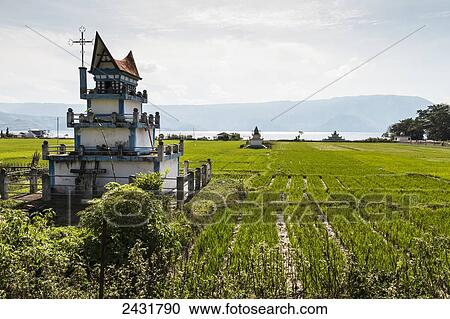 Stock Image - Batak tugu (Bone houses) on Samosir Island, Lake Toba, North Sumatra, Indonesia. Fotosearch