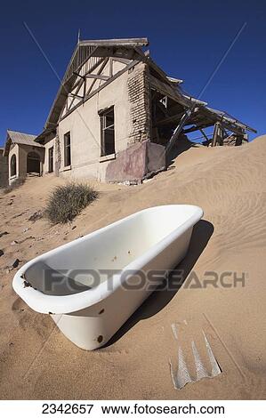 Stock Photo - Bathtub In Abandoned Town; Kolmanskop Ghost Town, Namibia. Fotosearch