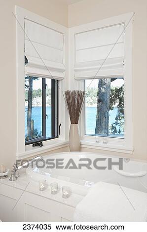Stock Photography - Bathtub In Bathroom With Ocean View; Mayne Island, British Columbia, Canada. Fotosearch
