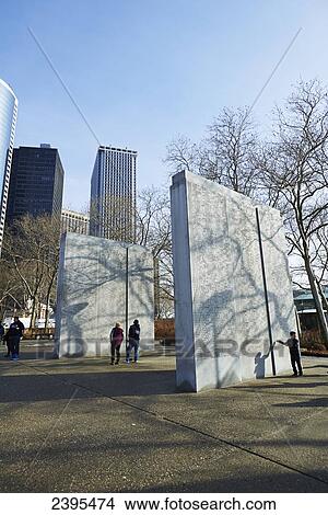 Picture - Battery Park World War Two monument with financial district in background; New York City, New York, United States of America. Fotosearch
