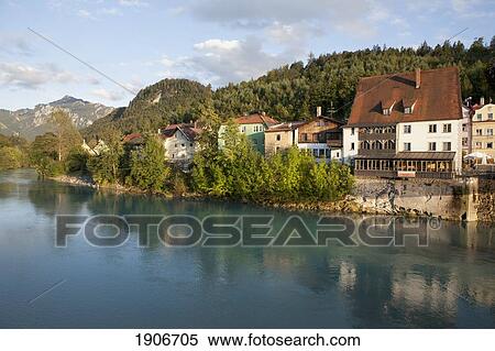 Bavarian Style Houses Reflecting On A River With Mountains In The Background; Fussen, Germany View Large Photo Image Stock Photography - Bavarian Style Houses Reflecting On A River With Mountains In The Background; Fussen, Germany. Fotosearch