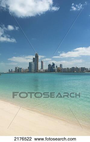 Stock Image - Beach Across The Bay From The Main Skyline Of Abu Dhabiabu Dhabi, United Arab Emirates. Fotosearch