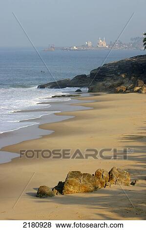 Stock Photo - Beach and buildings in the distance along the Malabar coast; Kerala, India. Fotosearch