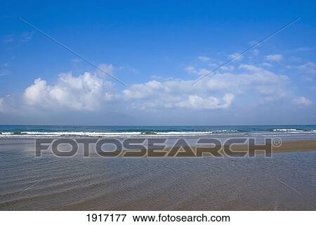 Beach And Clouds Over Water View Large Photo Image Stock Photo - Beach And Clouds Over Water. Fotosearch
