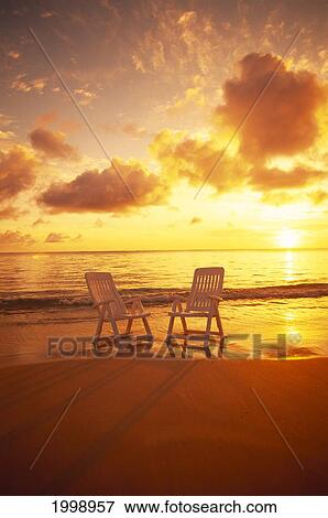 Beach Chairs Along Shoreline At Sunset B1466 View Large Photo Image Stock Photo - Beach Chairs Along Shoreline At Sunset B1466. Fotosearch