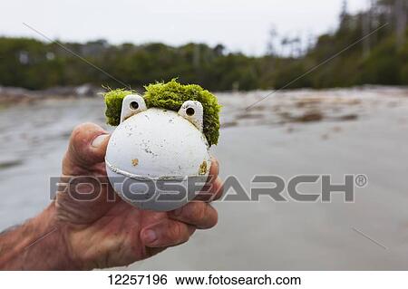 Stock Photograph - Beach finds and flotsam on a remote beach on Calvert Island; British Columbia, Canada. Fotosearch