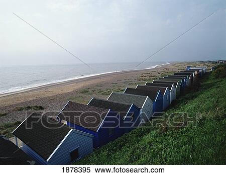Beach Huts Lined Up Along The Coast In Southwold, England View Large Photo Image Stock Photography - Beach Huts Lined Up Along The Coast In Southwold, England. Fotosearch