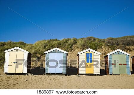 Beach Huts Lined Up In Front Of A Dune On Saunton Sands Beach View Large Photo Image Stock Photo - Beach Huts Lined Up In Front Of A Dune On Saunton Sands Beach. Fotosearch