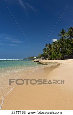 Stock Image - Beach near Unawatuna; Thalpe, Sri Lanka. Fotosearch