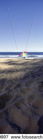 Stock Photo - Beach Umbrella By The Ocean. Fotosearch