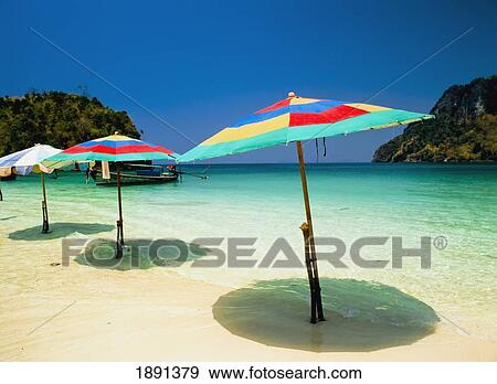 Beach Umbrellas In Shallow Water View Large Photo Image Stock Photo - Beach Umbrellas In Shallow Water. Fotosearch
