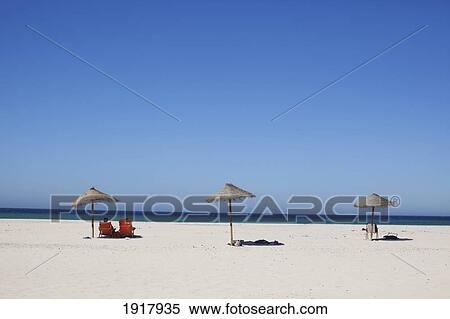 Beach Umbrellas On A White Sand Beach; Tarifa, Spain View Large Photo Image Stock Photography - Beach Umbrellas On A White Sand Beach; Tarifa, Spain. Fotosearch
