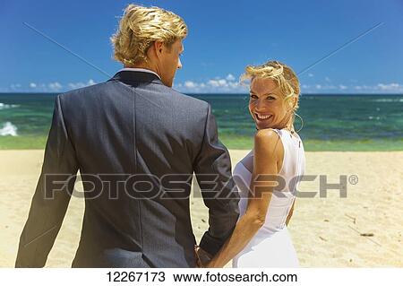 Stock Image - Beach wedding; Kauai, Hawaii, United States of America. Fotosearch