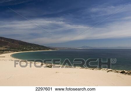 Stock Image - Beaches of the Atlantic Coast of Southern Spain - La Costa de la Luz. Beach of Valdevaqueros with Punta Paloma behind. Andalucia, Spain. Fotosearch