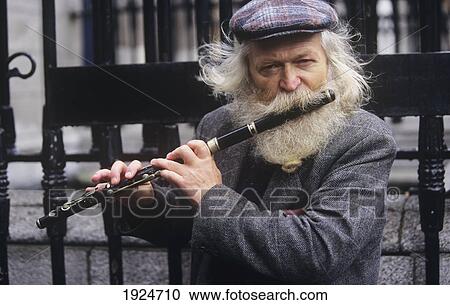 Bearded Flute Player Wearing Flat-Cap View Large Photo Image Stock Image - Bearded Flute Player Wearing Flat-Cap. Fotosearch