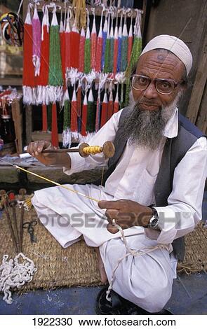 Stock Image - Bearded Silk Vendor. Fotosearch