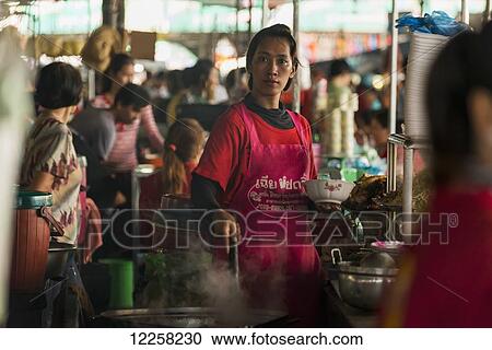 Beautiful Cambodian young woman working in a small restaurant in the Old Market; Battambang, Cambodia View Large Photo Image Stock Image - Beautiful Cambodian young woman working in a small restaurant in the Old Market; Battambang, Cambodia. Fotosearch