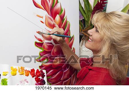 Stock Photography - Beautiful Female Artist Creating An Oil Painting Of A Ginger Blossom.. Fotosearch