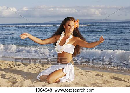Beautiful Hawaiian girl dancing hula on ocean shoreline View Large Photo Image Stock Photo - Beautiful Hawaiian girl dancing hula on ocean shoreline. Fotosearch