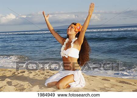 Beautiful Hawaiian girl dancing hula on ocean shoreline View Large Photo Image Stock Photo - Beautiful Hawaiian girl dancing hula on ocean shoreline. Fotosearch