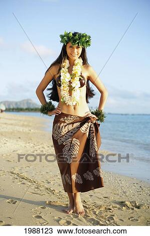 Stock Image - Beautiful Hawaiian Hula Girl On A Tropical Beach.. Fotosearch