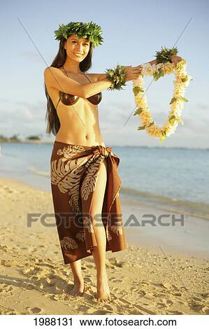 Stock Image - Beautiful Hawaiian Hula Girl On A Tropical Beach.. Fotosearch