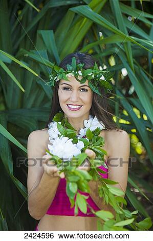 Beautiful hawaiian young woman in a garden; Kailua, Hawaii, United States of America View Large Photo Image Stock Photograph - Beautiful hawaiian young woman in a garden; Kailua, Hawaii, United States of America. Fotosearch