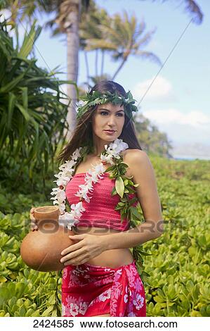 Stock Photography - Beautiful hawaiian young woman in a garden; Kailua, Hawaii, United States of America. Fotosearch