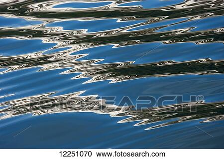 Beautiful patterns are formed on placid water; Whittier, Alaska, United States of America View Large Photo Image Stock Image - Beautiful patterns are formed on placid water; Whittier, Alaska, United States of America. Fotosearch