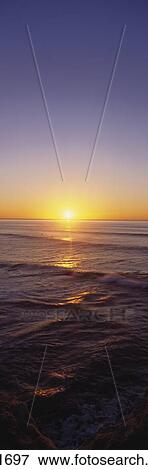 Stock Photo - Beautiful View Of Golden Sunset On Ocean Horizon, Verticle Panoramic.. Fotosearch