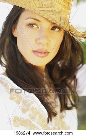Beautiful Young Woman Wearing A Straw Hat. View Large Photo Image Picture - Beautiful Young Woman Wearing A Straw Hat.. Fotosearch