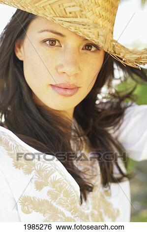 Beautiful Young Woman Wearing A Straw Hat. View Large Photo Image Stock Photograph - Beautiful Young Woman Wearing A Straw Hat.. Fotosearch