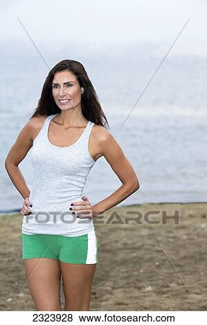 Beauty Portrait Of A Woman On A Beach In Jogging Clothes View Large Photo Image Stock Photo - Beauty Portrait Of A Woman On A Beach In Jogging Clothes. Fotosearch
